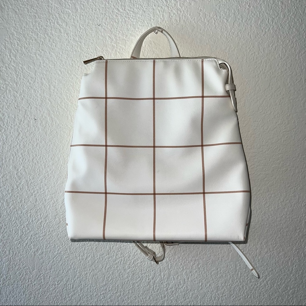 White and brown backpack purse